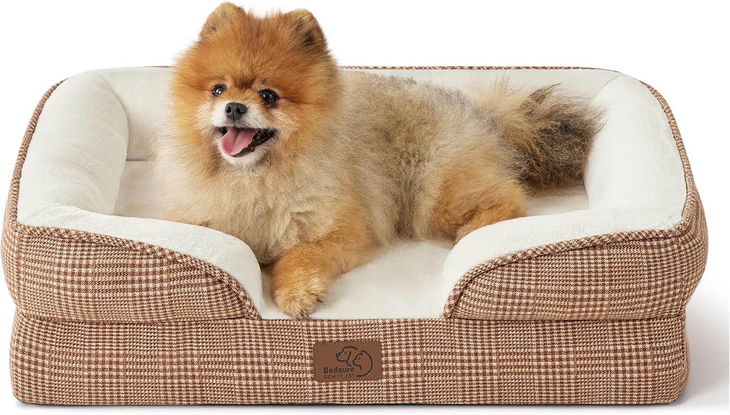 a pomeranian lying on the Bedsure Orthopedic Dog Bed.